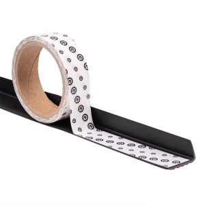 Roll of adhesive grip tape on surface