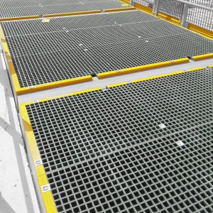 Industrial floor grating with yellow safety edges